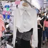 Kvinnors blusar 2023 Spring and Summer Korea Style Women Blus avancerad långärmad oregelbundenhet Turned Collar Pink White Black för