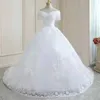 2023 Luxury Plus Size Bröllopsklänningar för brudpärlor Lång pärlhylsa Crystal Spets Appliqued Sequined Beach Brudklänningar plus storlek Tulle Boho Vestidos de Novia