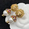 Pendientes de botón para mujer Diseñador de lujo Joyería de moda de la calle Perla Pendiente de león Señoras Pendientes de botón Diseñadores retro Pendientes de oro G 2306053BF