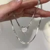 Collier d'aspiration magnétique de haute qualité et design à la mode, aimant de niche plein diamant collier de clavicule coeur