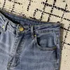 Nya kvinnors sexiga storstora mitten av midjan mager denim jeans fick sträcka smala knapp byxor jeans heta produkter c7