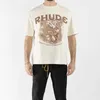 23ss Rhude Summer Cotton Flower Slogan Print Couple 1 T-shirt de manga curta branca S-xl Rpp5