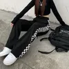 Kvinnors byxor retro checkerboard casual kvinnor street mode svarta sportbyxor streetwear lösa hög midja kvinnlig bred ben