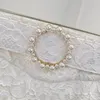 Survêtements femme 2023 printemps été haut qualité blanc Vintage dentelle perles crochet fleur creux femme court avec ceinture Blazer costume