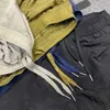 Pantalones cortos de diseñador para hombre Bordado Moda Verano Hombres Pantalones de chándal de piedra Mujeres famosas 12