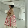 ガールドレス2023春の韓国の子供用服の女の子のスカートかわいい漫画サスペンダーエプロンドレスブティック