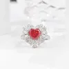 Anillo de plata esterlina con circón en forma de corazón azul oscuro para damas simples de moda europea y americana