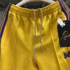 Pantalones de hombre Fasion Yellow Needles Track Hombres Mujeres Poly Smooth Sweatpants Butterfly Logo Knitted Purple Stripe Pantalones Bermudas