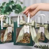 Emballage cadeau 10 pièces/lot sac haut de gamme fenêtre transparente conception tenu dans la main exquis mariage anniversaire petit emballage Carton vide