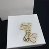 Designer brosch kvinnor lyx smycken guld koppar broscher män broche lowe hög kvalitet brosch med box mode hänge tillbehör