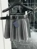 Kjolar designer designer akademisk stil matchning med midjeband, anti bländdräkt, veckad halv längd kjol bantning, överdimensionerad gren täckt a-line kort kjol