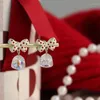 Boucles d'oreilles pendantes doux mignon rouge tacheté à pois nœud papillon artificiel brillant cristal cloche dame accessoires de mode pour les filles en gros