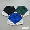 Designer Court Mode Vêtements de loisirs Shorts de plage en conserve Rhude 23fw High Street Industrie lourde Épissé Couple tissé Lâche Capris Joggers Sportswear Outdo