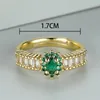 Fedi nuziali Anello di fidanzamento con zirconi bianchi femminili carini Anello di pietra ovale di cristallo verde con apertura color oro antico per le donne