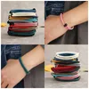 Bangle 12pcs/Lot الأوروبي والأمريكي سوار من التيتانيوم الفولاذ الأسود من المنسوجة الحبل غير القابل للصدأ