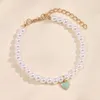 Urok bransoletki moda białe perłowe serc z koralikami dla kobiet dziewcząt ręcznie robiony koraliki łańcuch na dłoni bransoletki projekt biżuterii