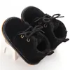 Botas de bebé con cordones sólidos a la moda para primeros caminantes, zapatos de Otoño Invierno con cordones cruzados, felpa cálida