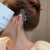 Ciondola il lampadario coreano brillante strass lunga nappa clip dell'orecchio del polsino dell'orecchio squisito farfalla clip orecchini gioielli della festa nuziale per le ragazze donne Z0608