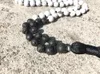 Hänge halsband Vit Howlite och Lava Stone 108 Mala pärlor Bön Tasselhalsband Knutade Yoga Buddha -smycken