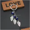 Kluczowe pierścionki Turkish Evil Eye Biekułki Lucky Blue Feather Tree Of Life Charm Charm Charm Vintage Blucz dla mężczyzn Women Car Wiselant D Dhgarden DH076