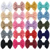 Accessoires cheveux 20 pcs/lot 4.5 '' Seersucker Gaufre Tissu Arc Avec Clip Pour Filles Doux Solide Noeud Boutique