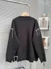 女性のニット女性セータースプライシング黒い白い色の一致する非対称性ルーズカーディガンセーター不規則なレジャー特大の編み物のトップス
