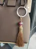 Nyckelringar DIY Handgjorda Tassels Keyring Plaid Kontrollerat mönster Multicolor Geometric Round Wood Pärlor Keychain för väskan Personlig gåva