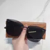 Neue modische schwarze rahmenlose Sonnenbrille für trendige Frauen und Internet-Prominente, die gleiche personalisierte Straßenfoto-Sonnenbrille