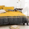 Set di biancheria da letto est biancheria da letto in quattro pezzi moda cotone doppio lenzuolo per uso domestico copripiumino splicing design giallo grigio 230609