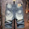 Jeans masculin 2023 Été européen et américain Ripped Cool Breezy pantalon droit taille cinq pantalons de mode pour hommes