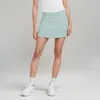 Yoga kläder nakna tyg kvinnor tennis sport kort kjol shorts veckad kjol som matchar falska två anti-exponering utomhus