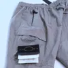Mens Designer Track Stones Island Pantalons Femmes Casual Cargo Multi-poches Sarouel Pantalon De Mode Hip Hop Taille Élastique Sportswear 2023kq65