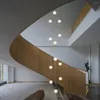 Lampes suspendues Modèles de lustre 2023 Suspension simple pour plafond Duplex Villa Éclairage d'escalier tournant Lustres d'escalier de haut niveau