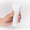 Tubo cosmético de plástico branco recarregável para bálsamo labial embalagem de teste garrafa de cabeça para baixo espremida para creme para as mãos xampu protetor solar Iwkea