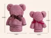 Bear towel accompanied by small gifts for children