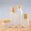 Frosted Glass Jar Cream Flaskor Runt kosmetiska burkar Hand Face Lotion Pump Bottle With Wood Cap Alqqh