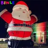 LED照明の巨大な20フィートインフレータブルクリスマスサンタモデル広告クリスマス老人クリスマスバルーンアウトドアパーティーの装飾
