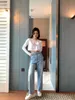 Jeans feminino designer de alta qualidade primavera/verão casual versátil cintura flor botão lavado calças jeans azul LFCK