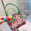 Totes Color Plaid Tessuto Basket Bag Borse Hairball Designer Borse per le donne 2022 Mini Borsa tessuta Candy Color Shopper Borse Frizione Nuovo