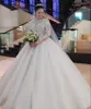 Luxo Vestido de Baile Vestidos de Noiva Comprimento Catedral Vestidos de Noiva Trem Longo Mangas Completas Apliques de Renda Cristais Frisados Árabe Dubai Vestido de Noiva 2023