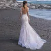 Strand långa ärmar sjöjungfru bröllopsklänning elegant ren v-hals spetsapplikationer illusion tillbaka med knapp tyll brud klänning skräddarsydd 2023