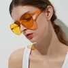 Sonnenbrille rahmenlos herzförmig Dame Frauen Süßigkeiten Farbe Linse Kunststoff Sonnenbrille klassische Vintage randlos feminino