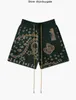 Rhude mäns shorts American High Street Sticked Hawaiian Flower Loose Cashew Flower Drawstring Woolen Green Mens and Women's Short