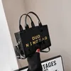 The New 2023 Edition Bright Face Tote Bag INS Women's Net Red Letter Simple Handheld Crossbody Bag 80% magasin de sortie en ligne