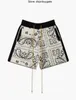 Rhude mäns shorts American High Street Sticked Hawaiian Flower Loose Cashew Flower Drawstring Woolen Green Mens and Women's Short