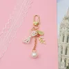 Nyckelringar söta koreanska flickor Pearl Bow-Knot Keychain Metal Leaf Portrait Pendant Key Bag Accessories Friends Present Trendy Women SMYELLT