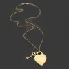 10 anni di fabbrica di gioielli all'ingrosso T lettera grande collana di colore cuore chiave con sacchetto per la polvere adatto per regali di coppia.