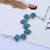 Collana Orecchini Set FYJS Bracciale con pendente a goccia d'acqua placcato argento unico Bracciale in pietra turchese blu