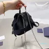 Designer mini zaino in nylon da donna borsette piccole borsa catena staccabile zaino tinta unita argento hardware coulisse secchiello borse a tracolla piccole borse per cuffie