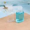 Bouteille en plastique PET de désinfectant pour les mains de 30 ml avec bouteilles carrées à capuchon rabattable pour cosmétiques Essence Gdapg